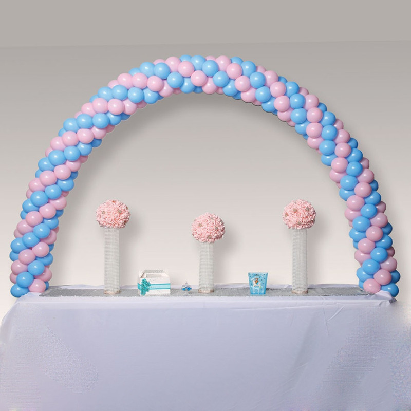 Table Balloon Arch Kit. White and clear plastic.  Package includes 2 count clamps, 6 count section poles, and 30 count balloon rings. Assembly required. Measures 5ft tall and 8ft wide when assembled. Balloons not included.