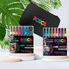 PoscART Travel Art Kit 2 featuring 16 assorted and 8 glitter POSCA PC-3M markers with eco-friendly black carry case, displayed on a light surface with greenery.
