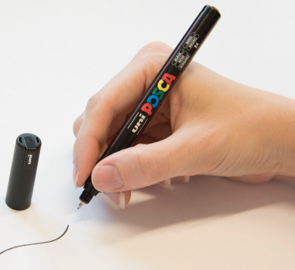 Artist using POSCA PC-1MR Paint Marker for precision linework and intricate detailing.