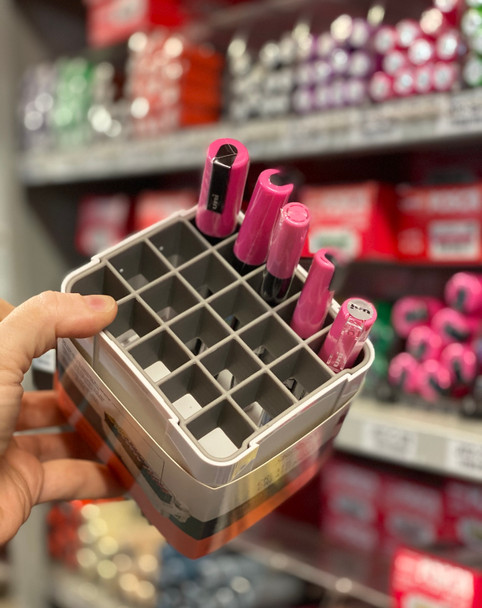 Deflecto Interlocking Marker Organiser being held with POSCA markers stored in the compartment display. | PoscART