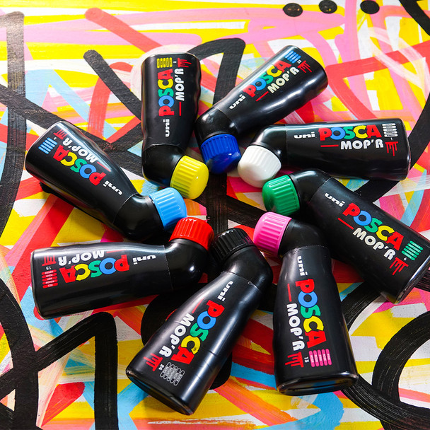 Cluster of POSCA PCM-22 MOP’R markers scattered artistically showing colour-coded caps