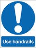 Use handrails sign