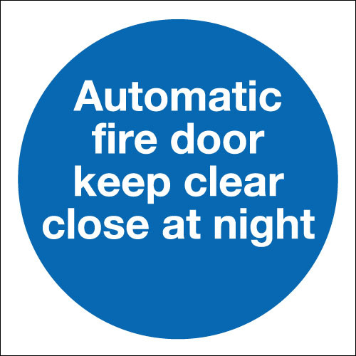 Automatic fire door keep clear close at night sign.