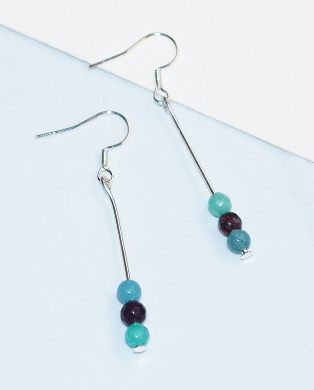 Lagom Agate Bar Earrings front view on split paper background 