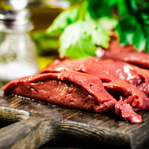 Sliced Pork Liver on Cutting Board Sliced Pork Liver on Cutting Board