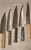 Assortment of Chefs knives, different handle materials and steel combinations creating the best knife possible for steady precise use in anyone's kitchen.