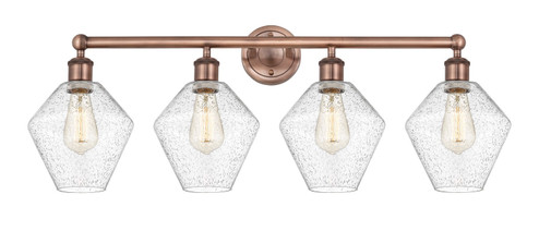 Edison Four Light Bath Vanity in Antique Copper (405|616-4W-AC-G654-8)