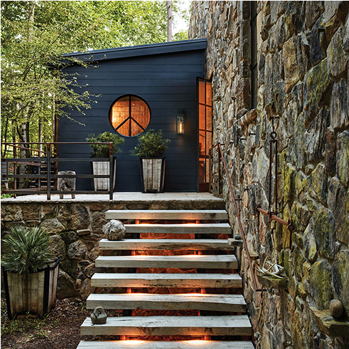 A back patio with outdoor lighting fixtures