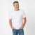 Just Sweatshirts Ultra Soft 100% Combed Cotton T-Shirt, white, short sleeve, on a man with blue jeans.