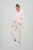 Just Sweatshirts Ultra Soft Ladies Classic Sweatpants in pale pink 100% cotton, showcasing a relaxed fit.