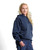 Just Sweatshirts Hooded Pullover Navy Sand 100% Cotton, navy blue sweatshirt with hood and kangaroo pockets on woman.