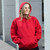 Just Sweatshirts Hooded Pullover Ruby Red 100% Cotton, red hooded sweatshirt with kangaroo pockets on a woman.