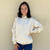 Just Sweatshirts Natural 100% Cotton no  hooded pullover sweatshirt, white color, woman wearing, casual outfit style.