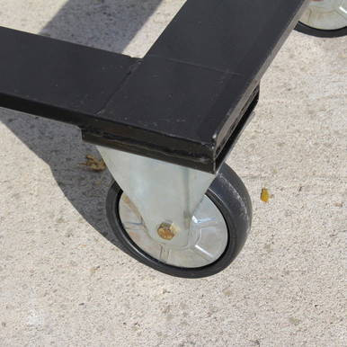 Heavy Duty Chair Cart, close-up of the wheel and black metal frame on concrete surface.
