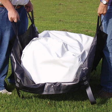E-Z Equipment Carrier, a portable gear bag designed for outdoor use, being held open by two people on a grassy field.