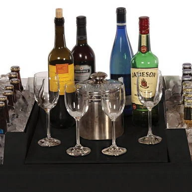 Black Little Chiller Insert, a black rectangular beverage chiller with surrounding bottles and glasses on a party table.