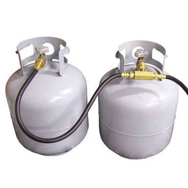 T-Block Manifold, industrial gas distribution system with two white cylinders connected by a metal hose and T-shaped manifold for controlling flow.