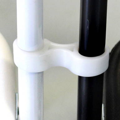White Poly Chair Ganging Clip, close-up of a white plastic clip securely attaching two chairs' legs together.