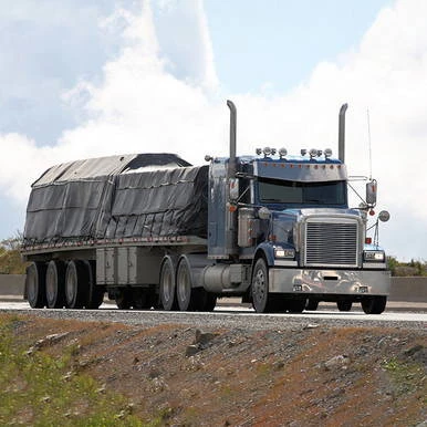20' x 18' Lumber Tarp, large black tarp covering a truck's cargo area for protection.