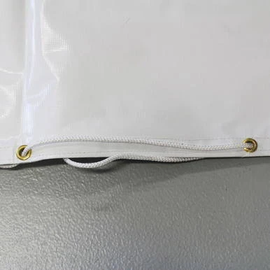 32'' Diameter Round Tent Bag, close-up of the bag's white fabric and gold eyelet grommets with a zipper at the bottom.