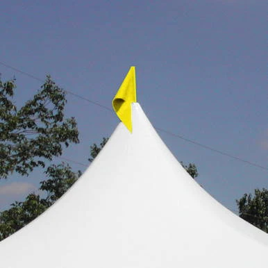 Yellow Pole Flag, bright yellow flag attached to the top of a white tent pole against a clear blue sky.