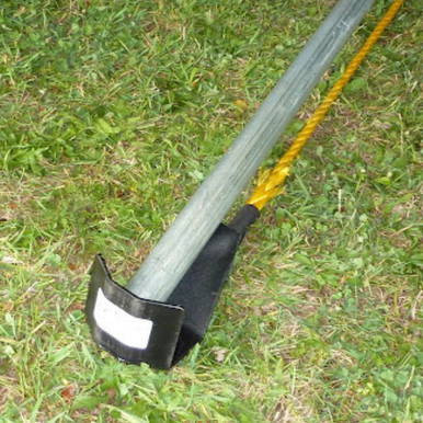4" Raize It! Plate, safety plate with a black rubber edge on a grassy outdoor ground.