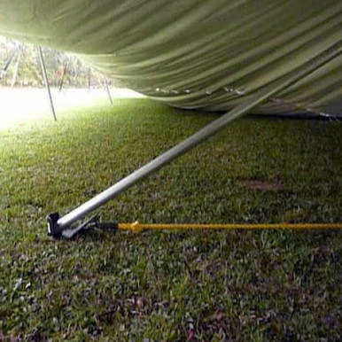 4" Raize It! Plate, image showing the underside of a boat supported by the Raize It! plate on grassy ground for stability and elevation.