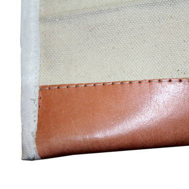 14'' x 31'' Stake Bag, close-up image showing the corner with a brown leather-like material stitched onto a durable fabric background.