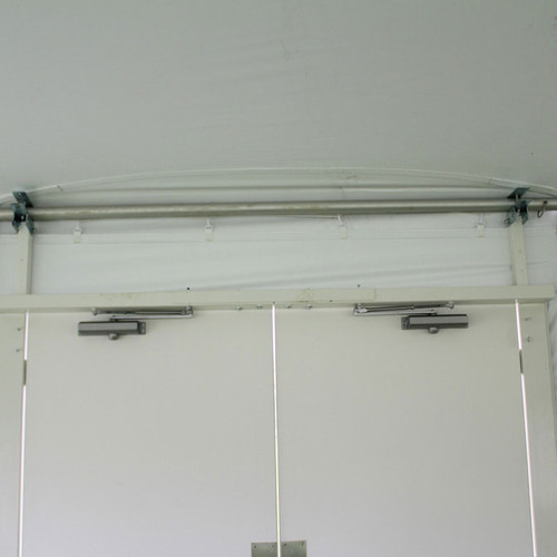 The pole tent eave kit forms a solid valance bar for door attachment.