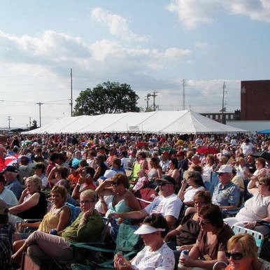Celina Tent 40' x 140' Classic Series Pole Tent, Sectional Tent Top, Complete, outdoor event setup with large white tent sheltering a crowd of people.