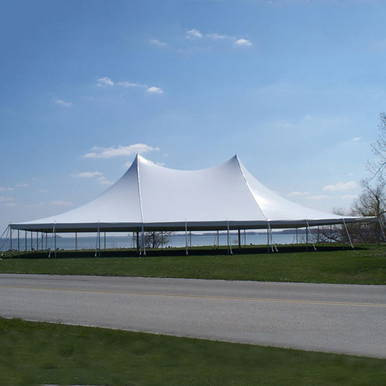 Celina Tent 60' x 90' Premiere II Series High Peak Pole Tent, Sectional Tent Top, Complete, on an outdoor field under a blue sky with clouds.