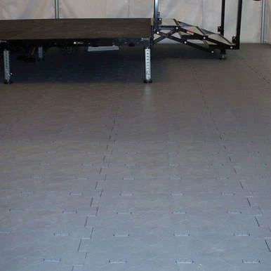 PRO Portable Surface Cover, image showing a large gray covering applied to a floor in a garage or workshop setting