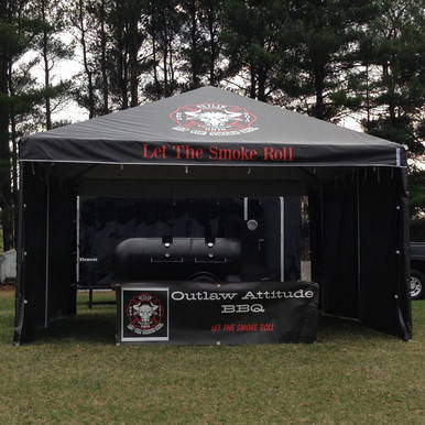 Celina Tent 15' x 20' Classic Series Frame Tent, 1 Piece Tent Top, Complete, outdoor event tent with black canopy, red lettering, and promotional signage for Outlaw Attitude BBQ.