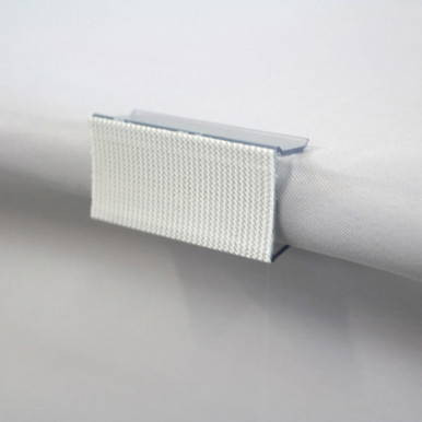 Celina Tent 3/4'' Table Skirting Clips, close-up of a white plastic clip attached to a table skirting for event decoration.