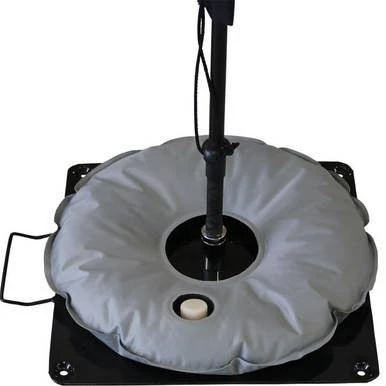Flag Water Weight Bag, a round water-filled training resistance bag with a flag design, mounted on a black base for fitness and strength training.