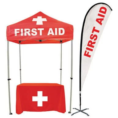 Celina Tent Fast Shade Package 7G, portable emergency first aid tent with a red canopy and table featuring a white medical cross, along with a designated first aid flag for outdoor medical assistance.