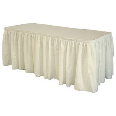 Celina Tent 17' Ivory Polyester Skirting, a long, elegant beige skirt draped over a table for event décor.