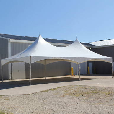 20' x 40' Pinnacle Series, White Cross Cable Tent, Complete, outdoor event tent with a white fabric canopy and cross cable support structure, set up on a paved area outside a building under a clear blue sky.