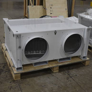 5 Ton Heating and Cooling Mobile Unit, white industrial HVAC cooling and heating unit with dual fans on a wooden pallet in a warehouse.