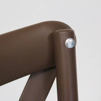 Chocolate Dover Cross Back Chair, close-up of the brown chair's backrest and supporting leg with a silver screw.