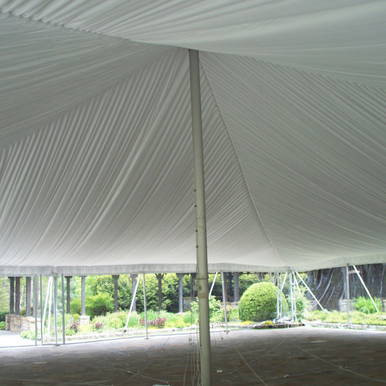 20' x 20' Classic Pole Tent Liner, interior view showing the fabric ceiling and supporting pole in a large outdoor event tent.