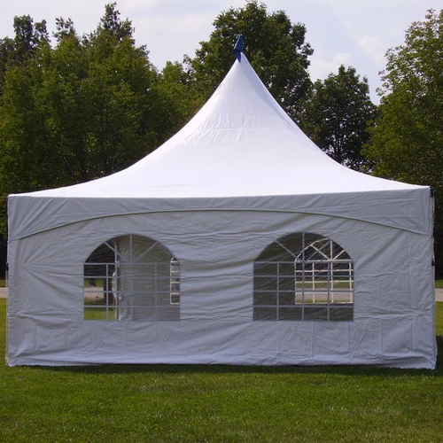 Weekend Warrior Event Ready Bundle, outdoor event tent with white fabric and clear window panels on a grassy field with trees in the background.