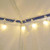 Tent Globe Lights, string of warm white globe string lights hanging in a tent interior for decorative ambient lighting.