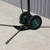 12' Frame Tent Jack, outdoor support equipment with large black wheels and green hubs on concrete ground.