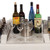 White Little Chiller Insert, product image showing a stainless steel chiller insert placed in the center of a table with various bottles and glasses around it.