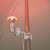 PAR38 Single Flood Lighting, outdoor security light mounted on a pole emitting a bright red glow.