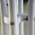 31'' Resin Cocktail Table, close-up view of the white resin tabletop frame and metal support structure.
