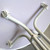 31'' Resin Cocktail Table, close-up view of the white metal legs and support structure.