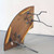 Celina Tent 3' x 8' Serpentine Table, metal legs and wooden tabletop overturned for storage or assembly.