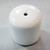 White Replacement Chair Feet, a small cylindrical ceramic or plastic furniture leg cap with a smooth surface and a central hole for easy installation.